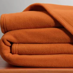 Couverture POLAIRE UNIE microfibre tempérée orange cuivré